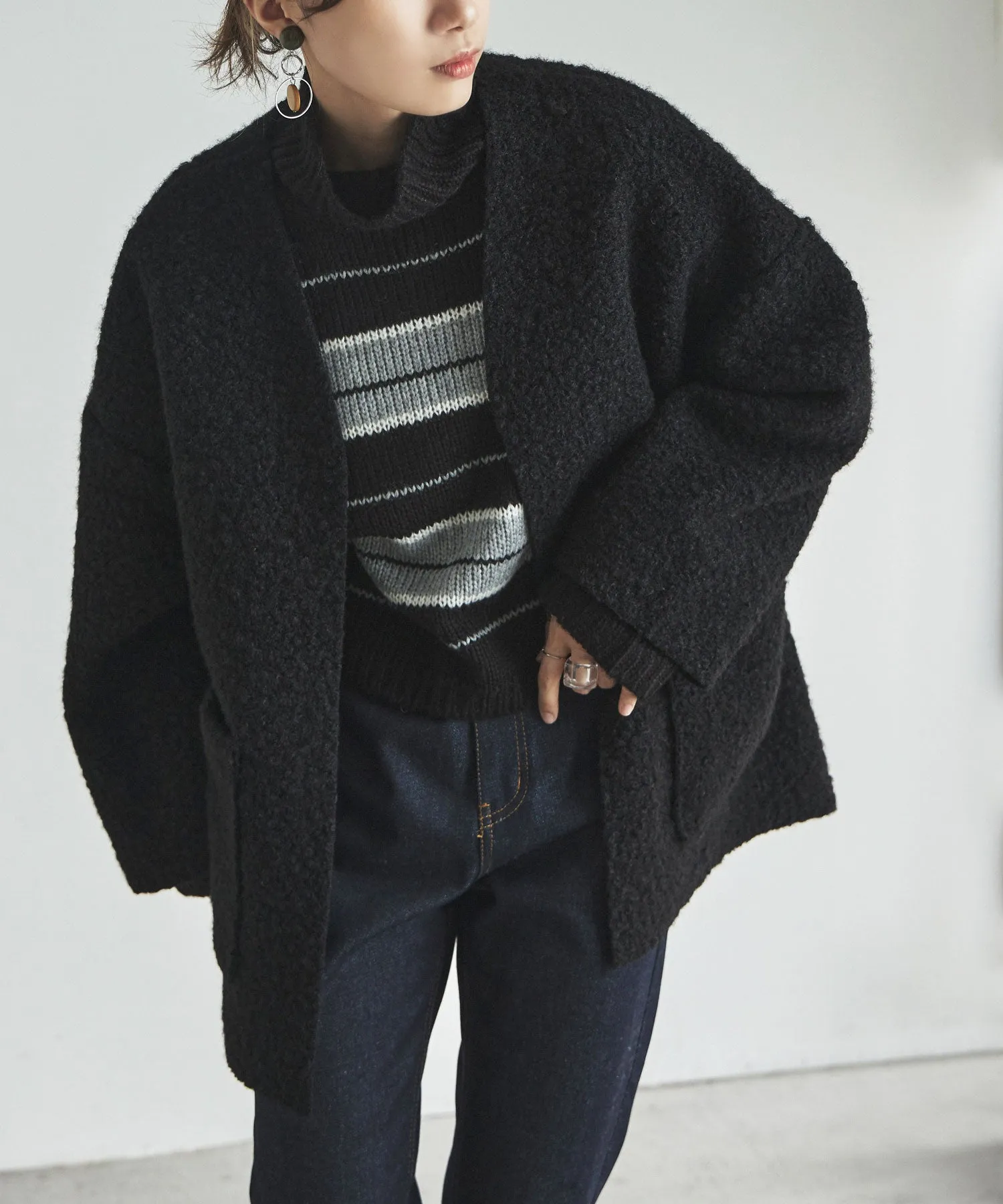 Ring wool over cardigan