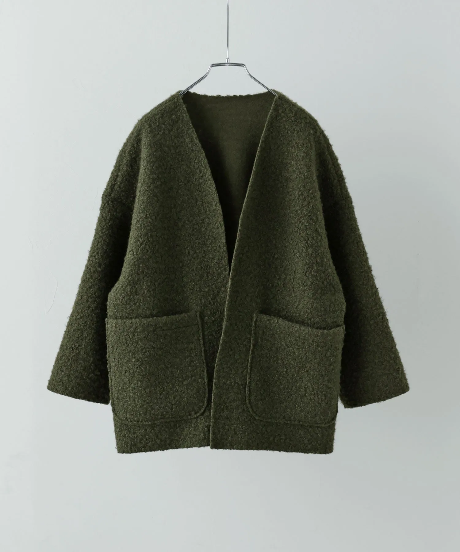 Ring wool over cardigan
