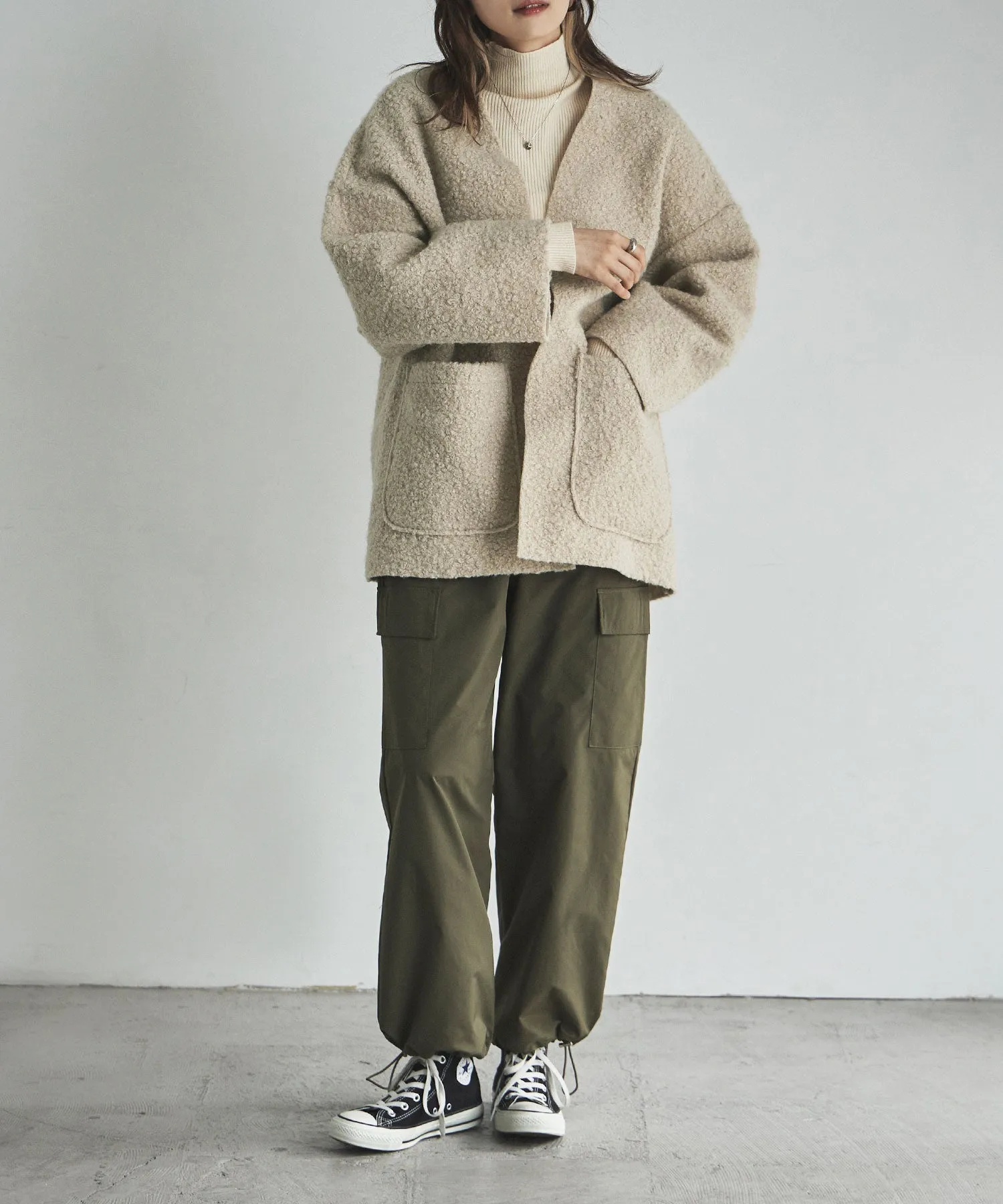 Ring wool over cardigan