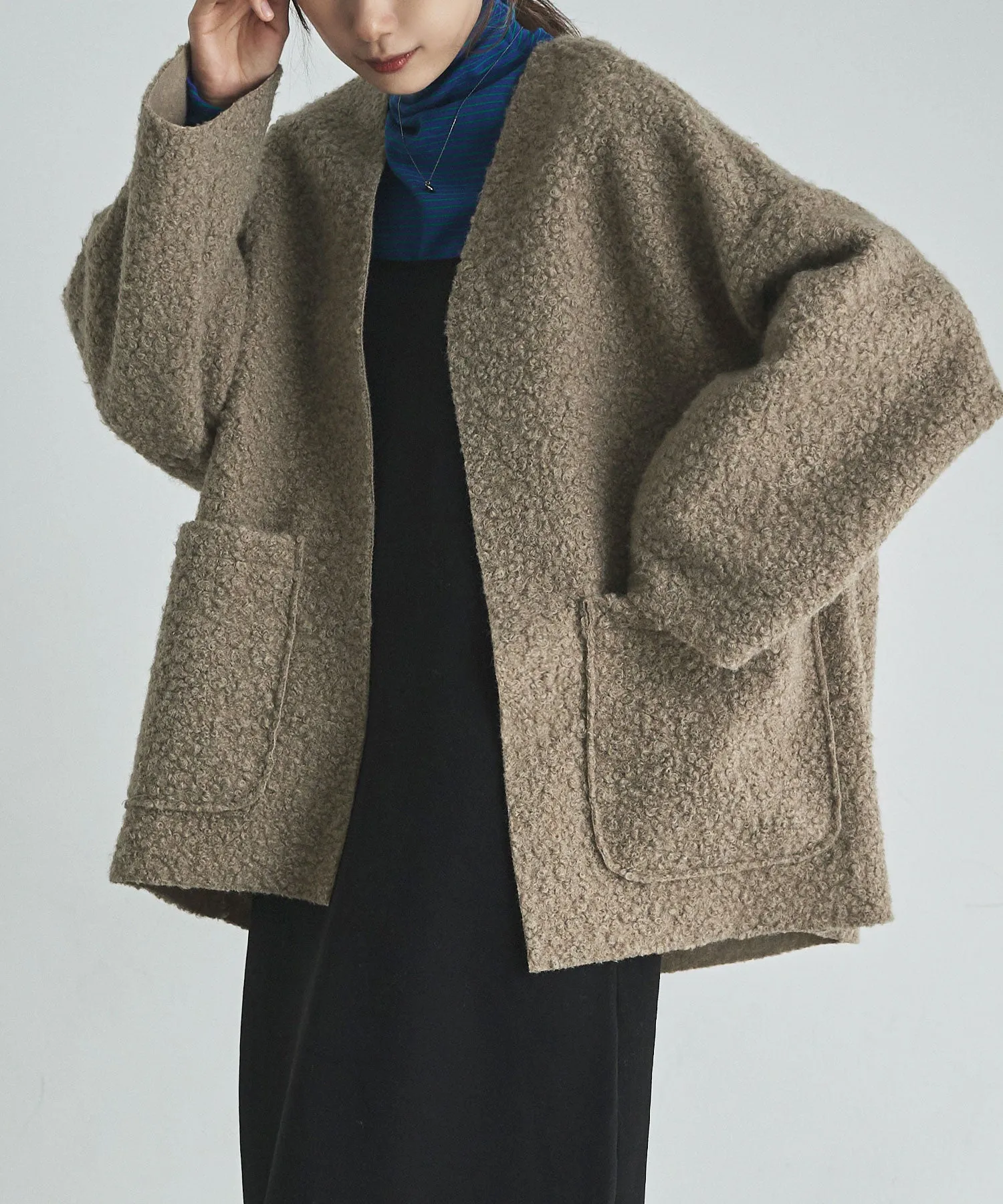 Ring wool over cardigan