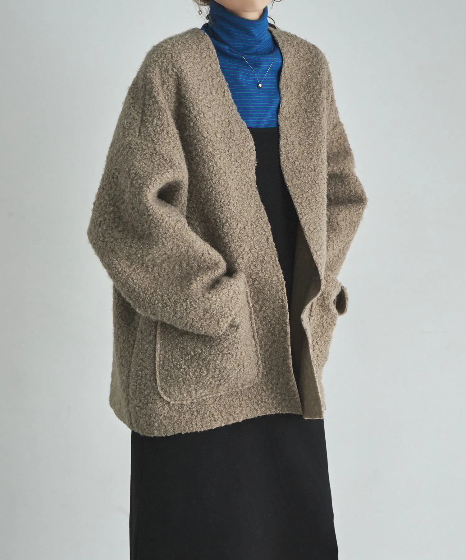 Ring wool over cardigan