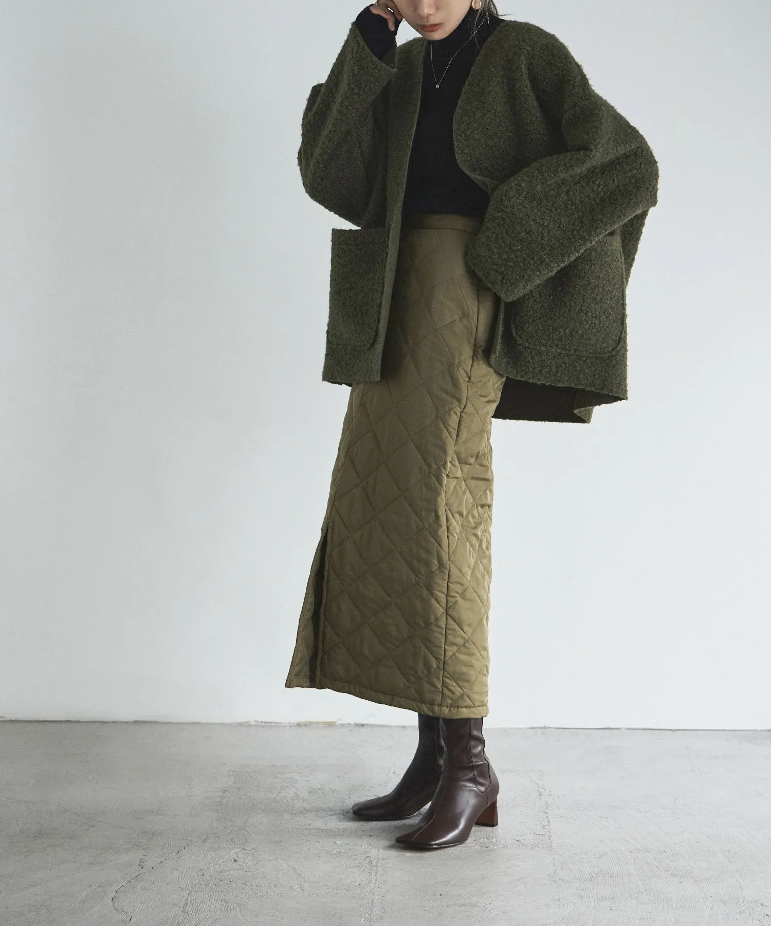 Ring wool over cardigan