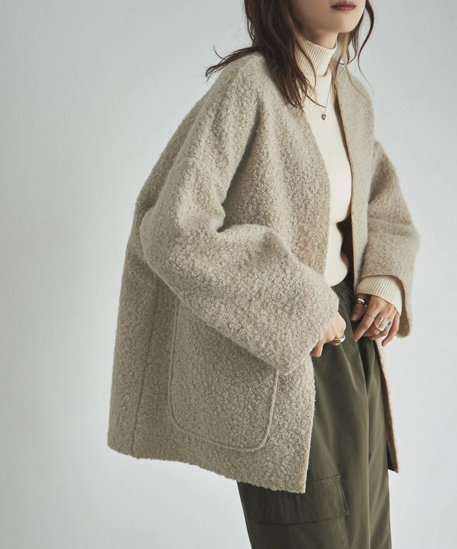 Ring wool over cardigan