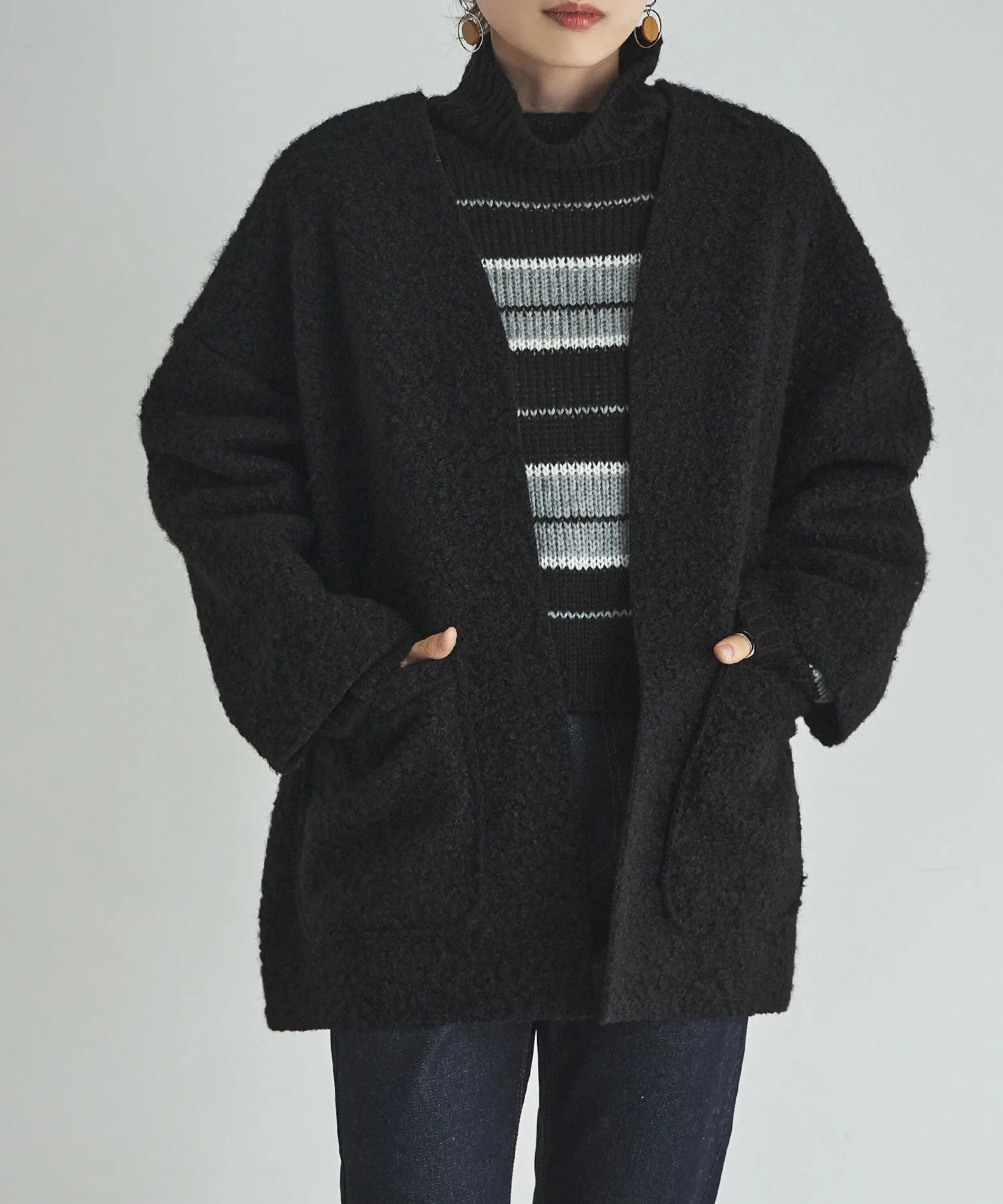 Ring wool over cardigan