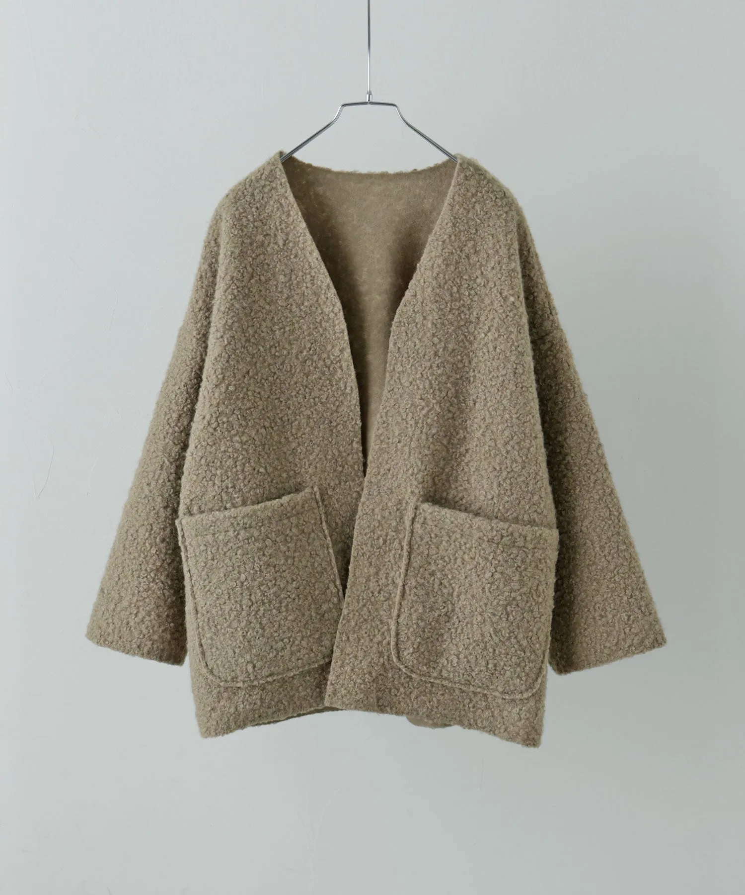 Ring wool over cardigan