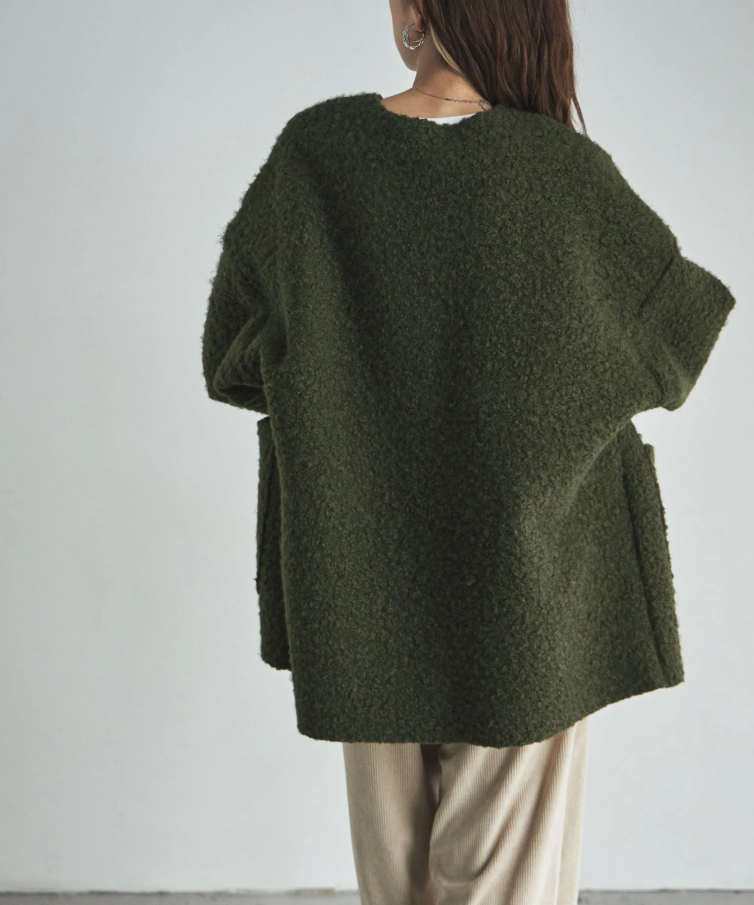 Ring wool over cardigan