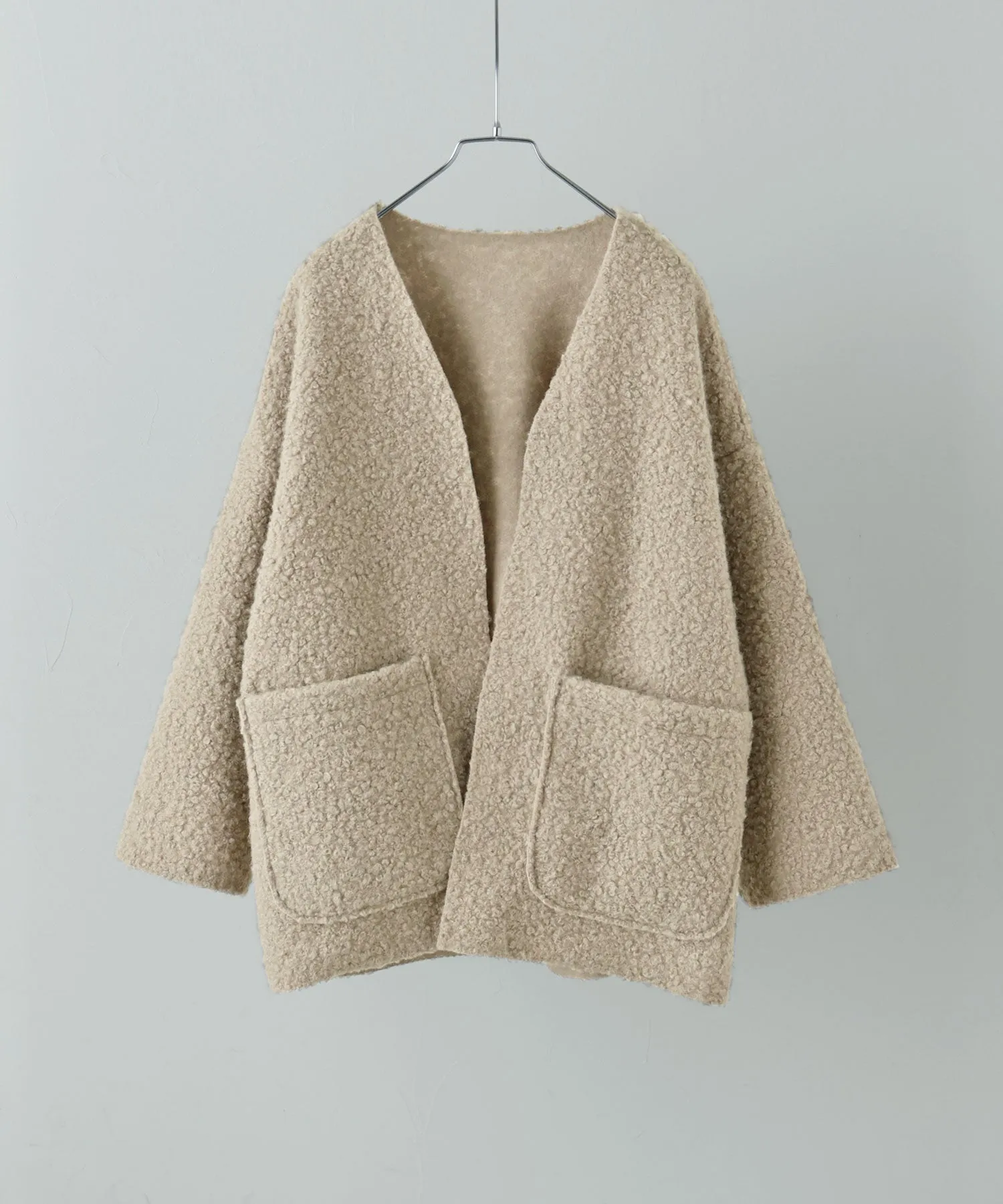 Ring wool over cardigan