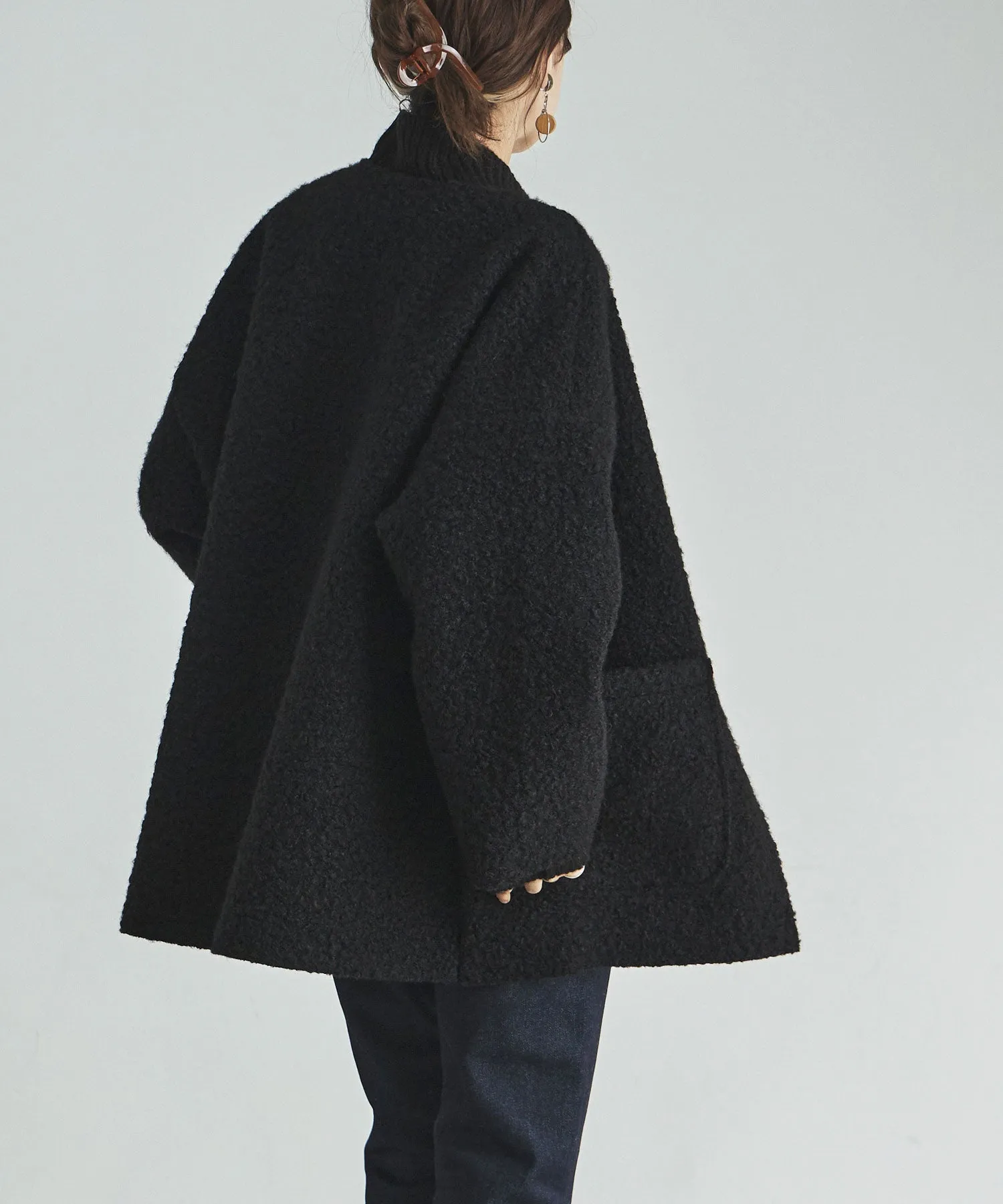 Ring wool over cardigan