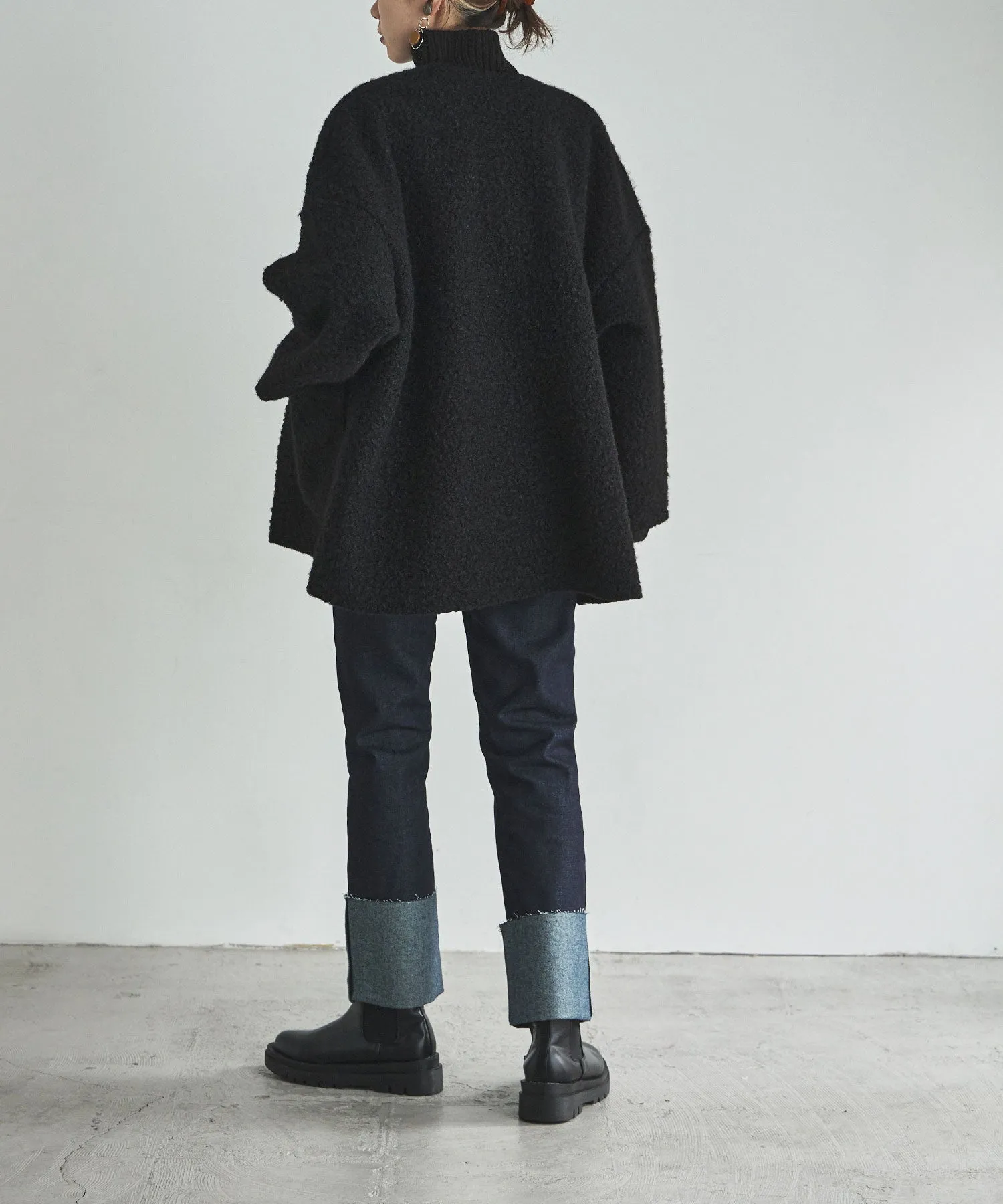 Ring wool over cardigan