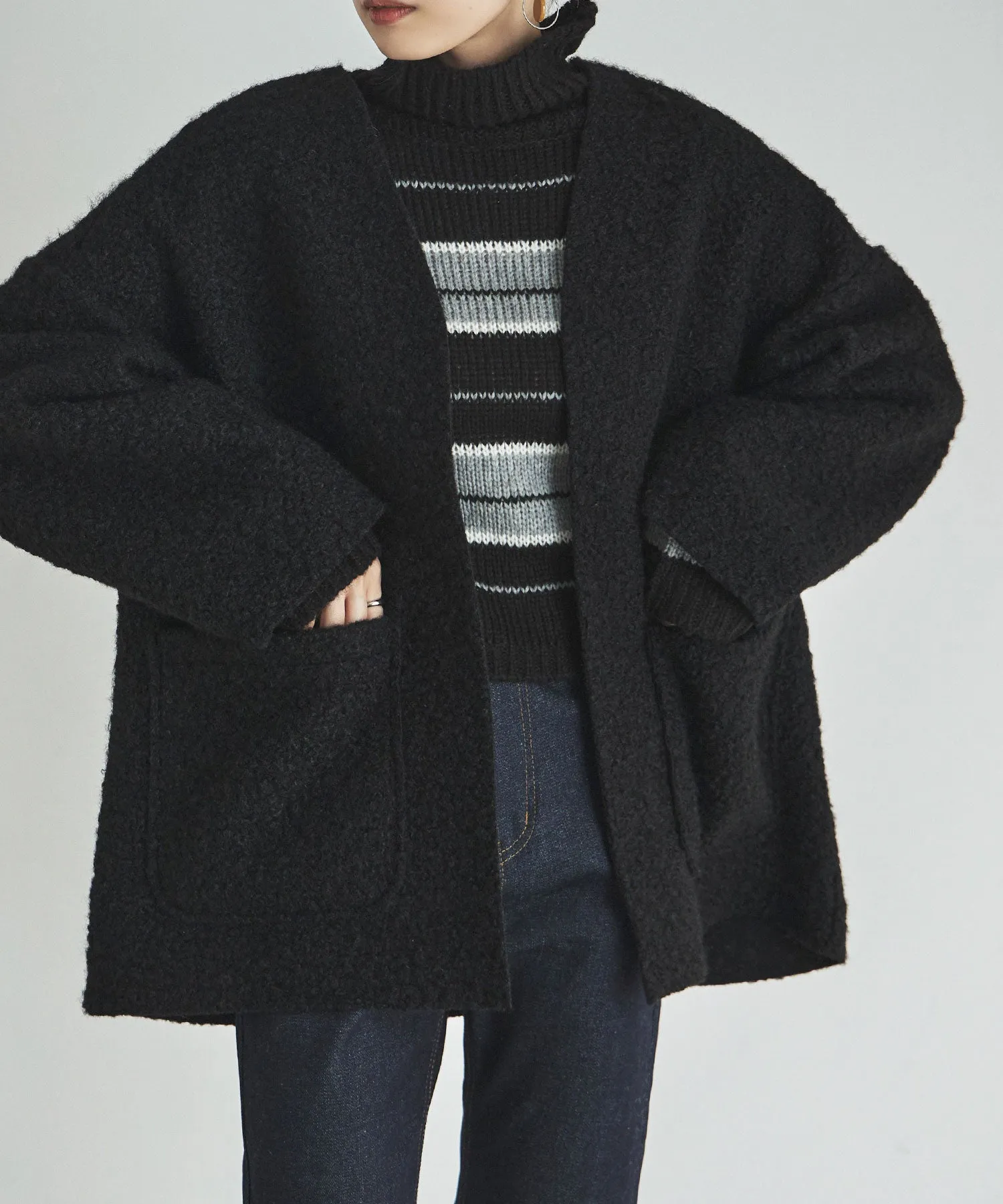 Ring wool over cardigan