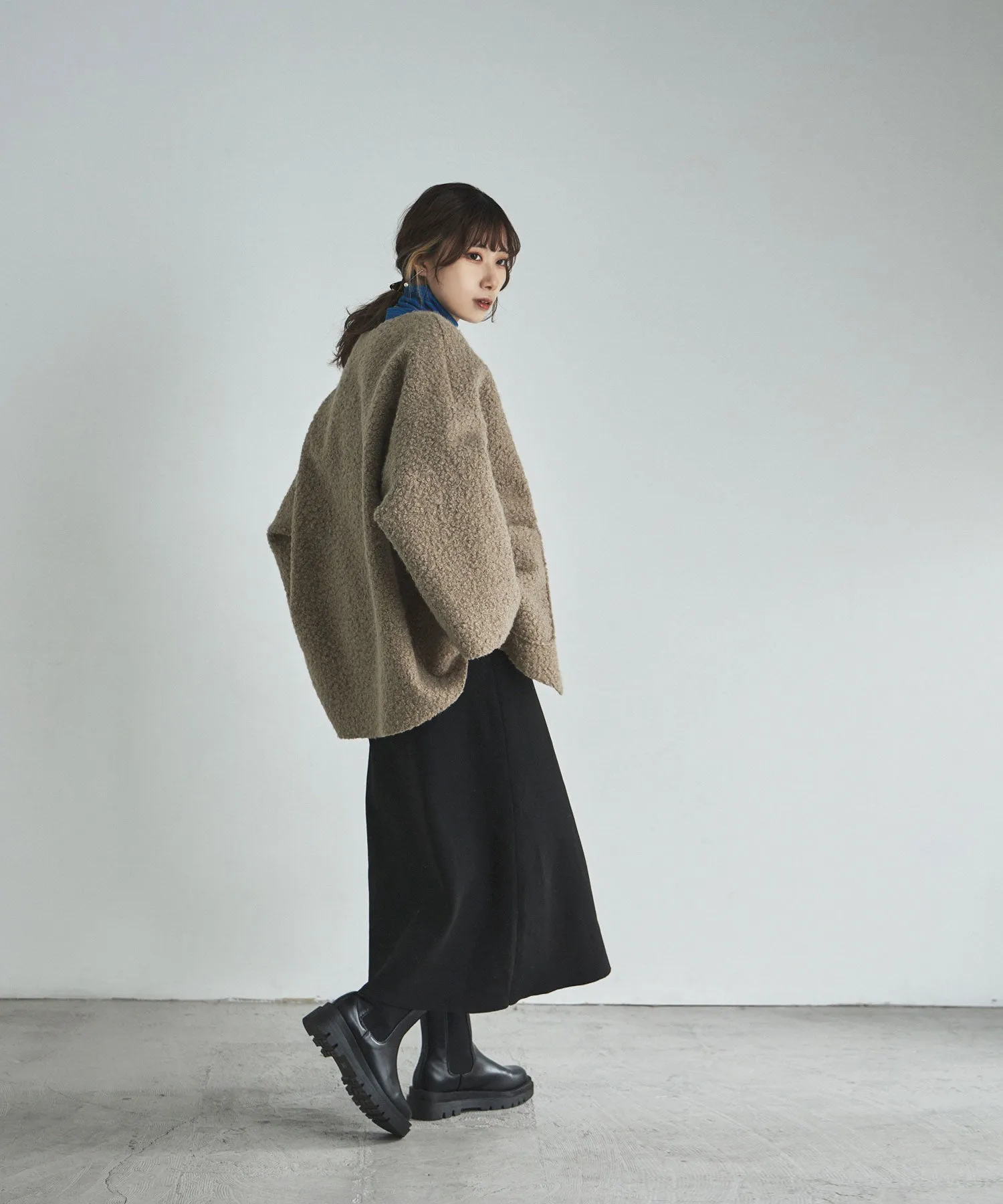 Ring wool over cardigan