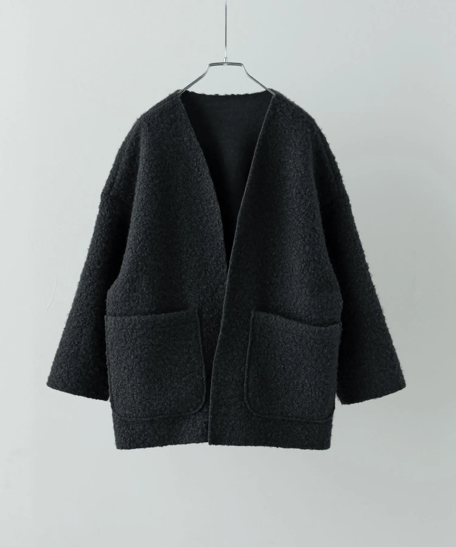 Ring wool over cardigan