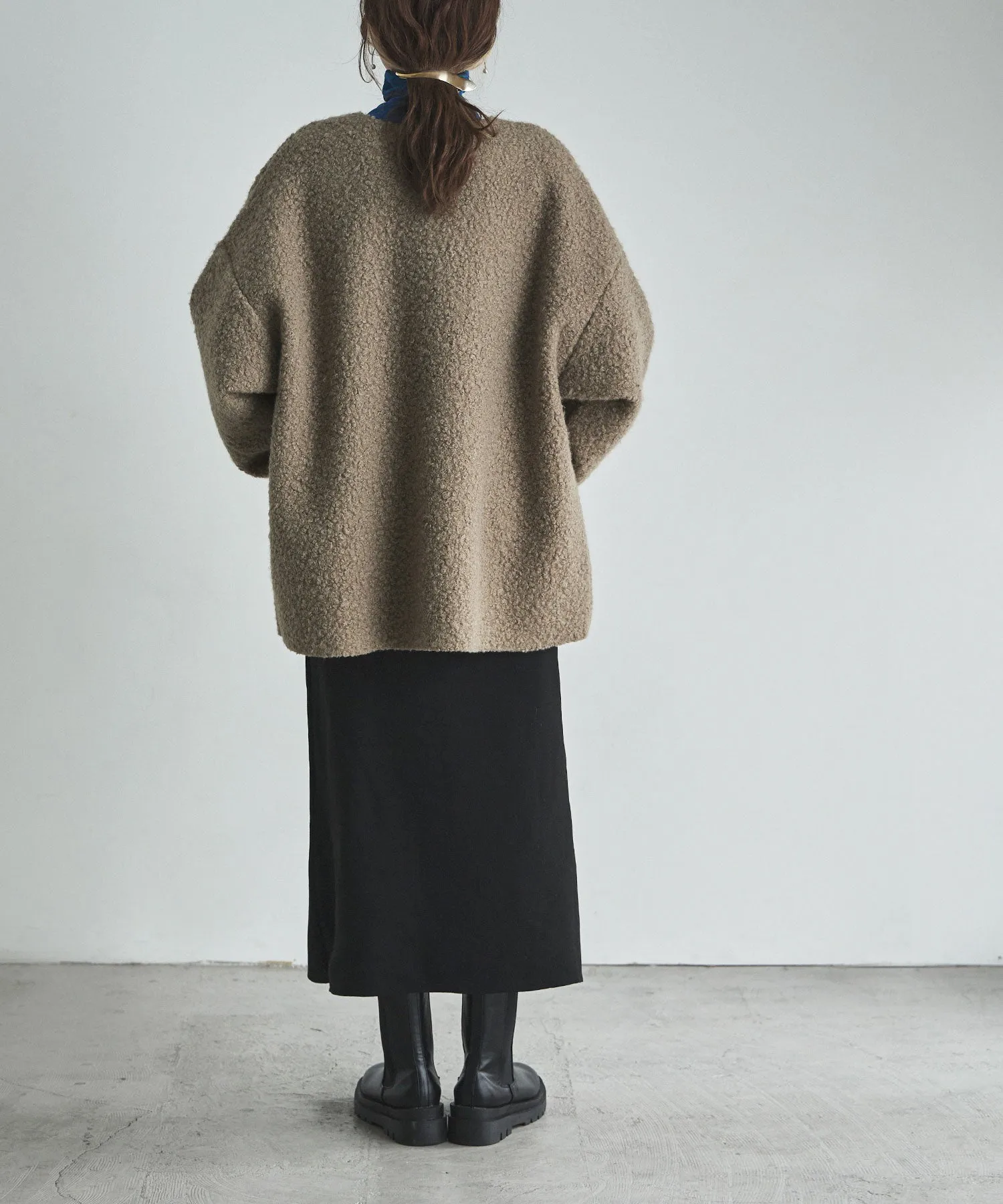 Ring wool over cardigan