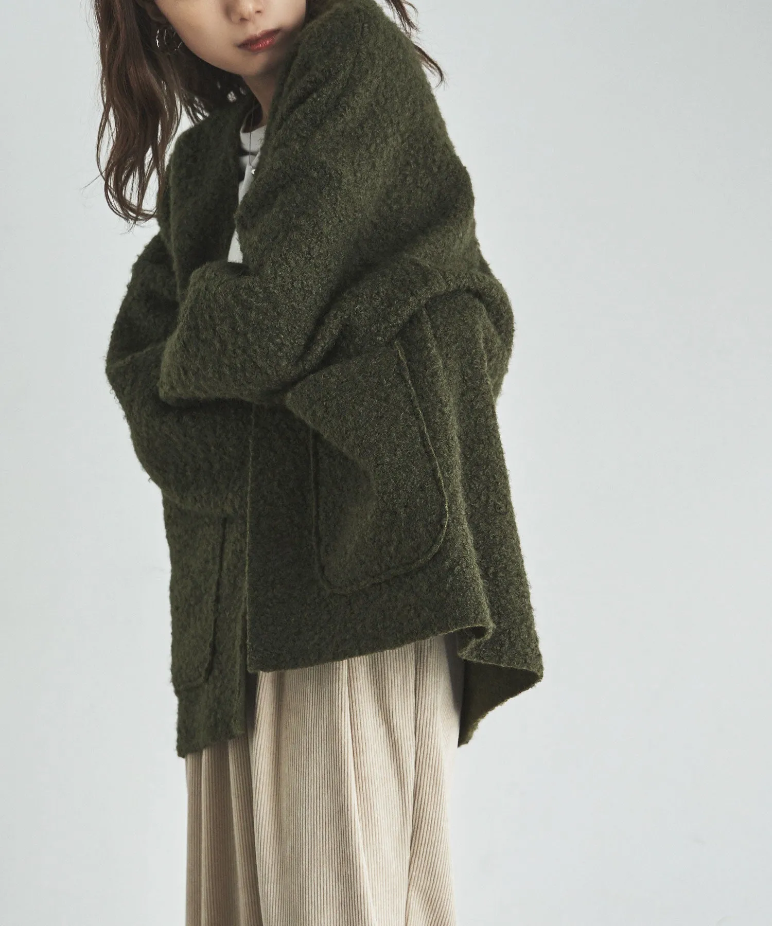 Ring wool over cardigan