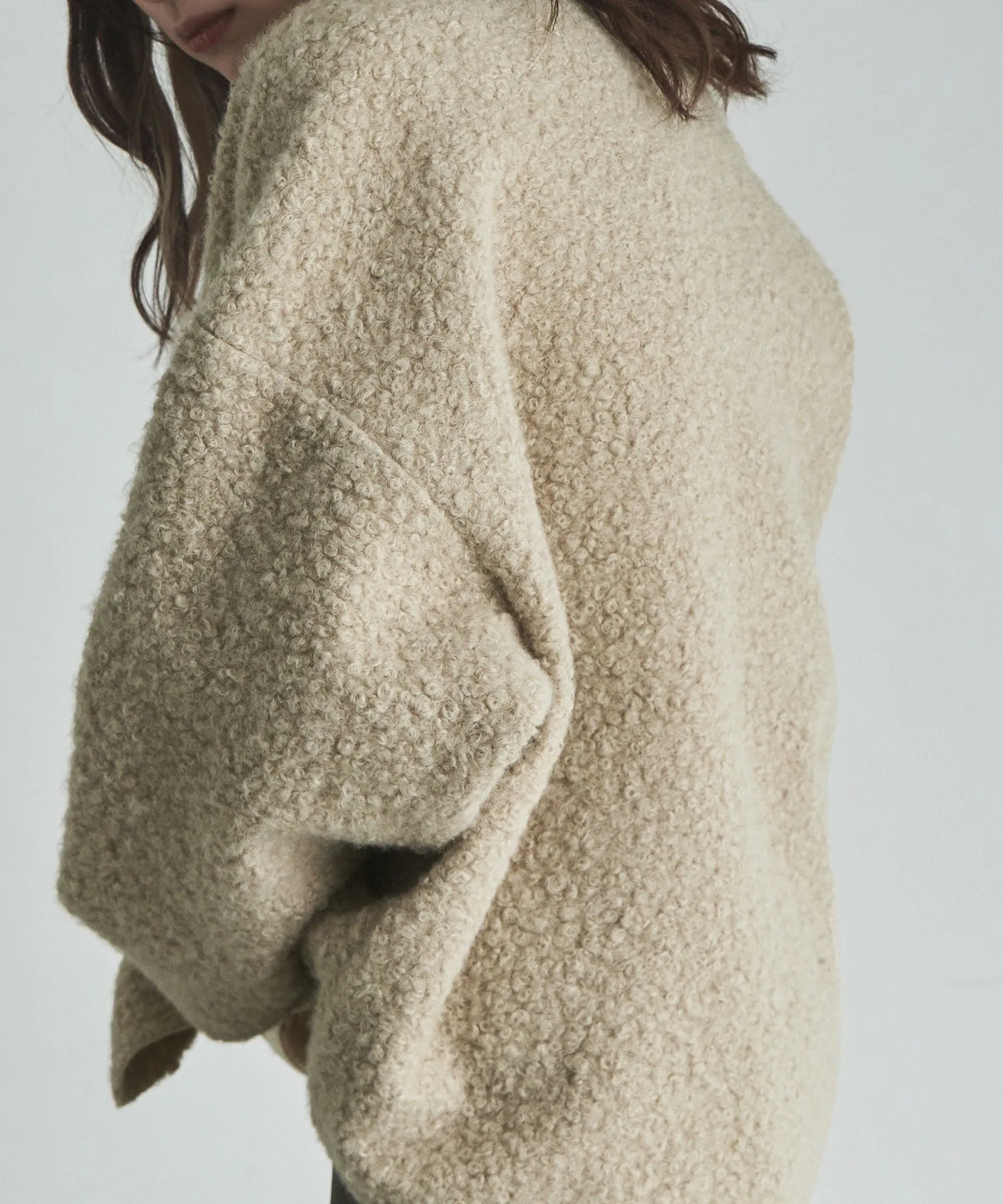 Ring wool over cardigan