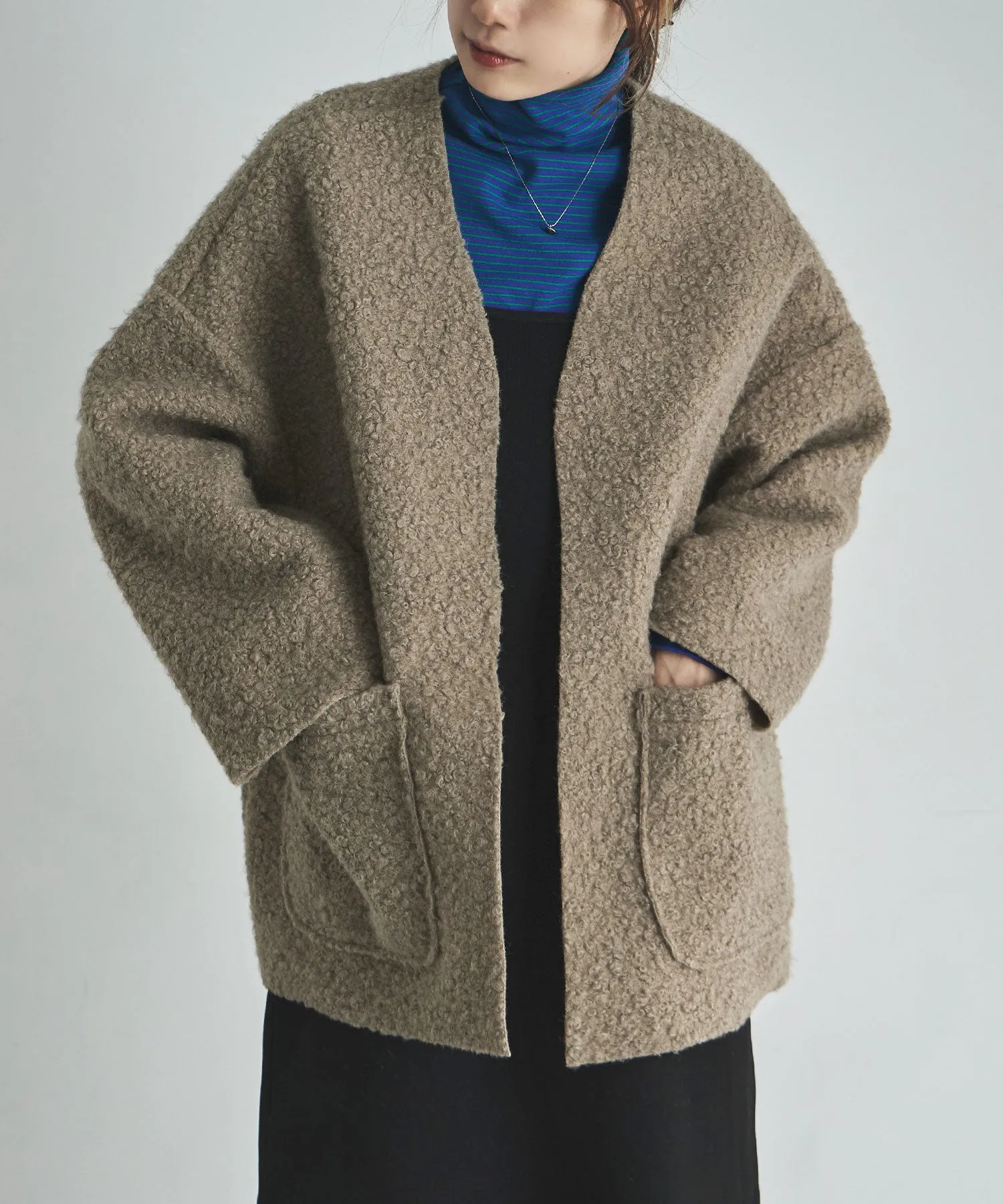 Ring wool over cardigan