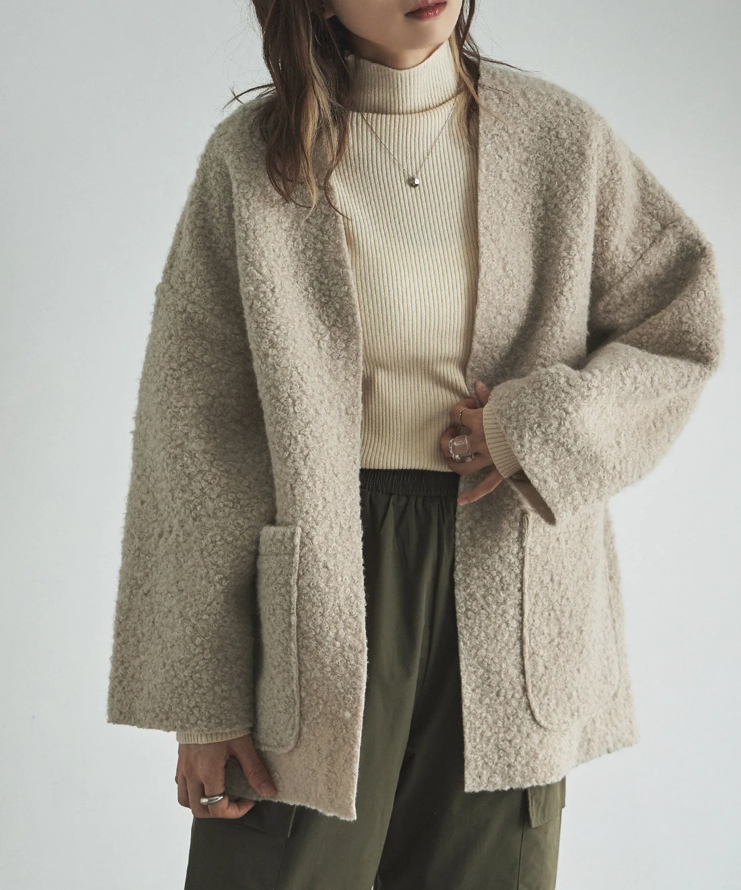 Ring wool over cardigan