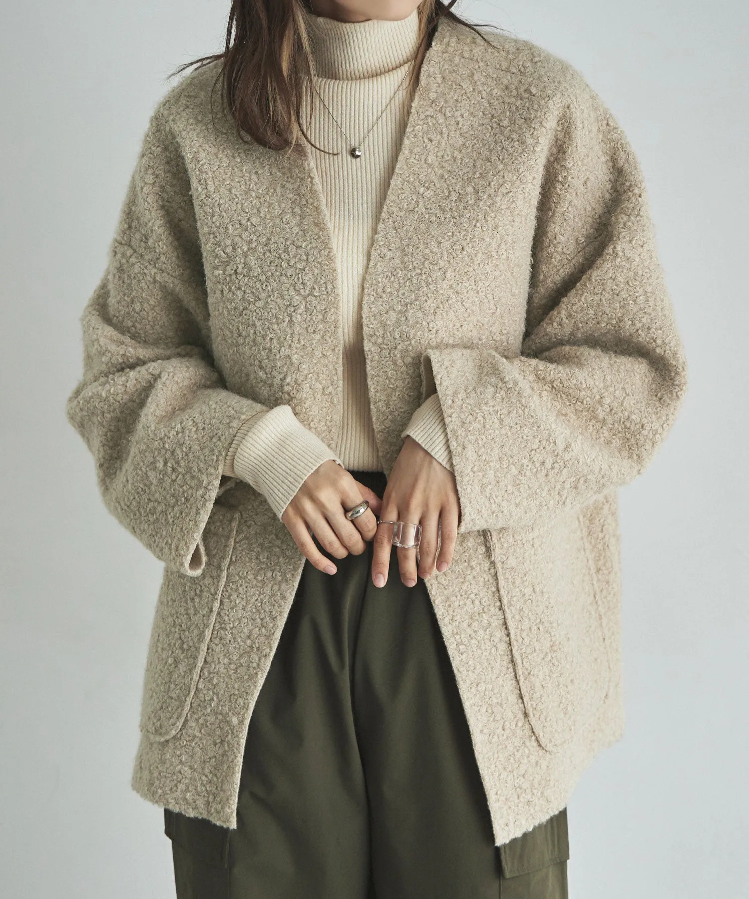Ring wool over cardigan