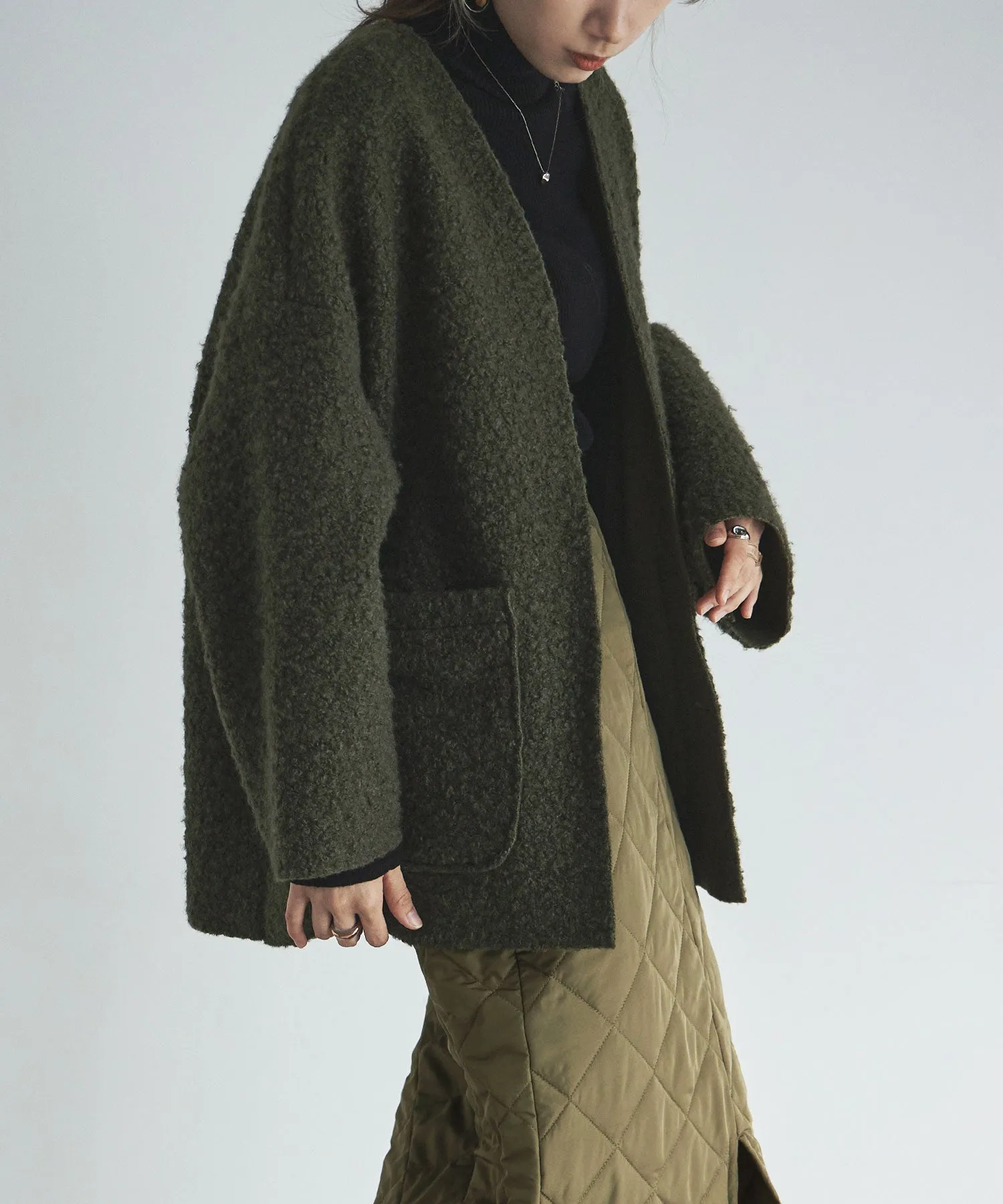 Ring wool over cardigan