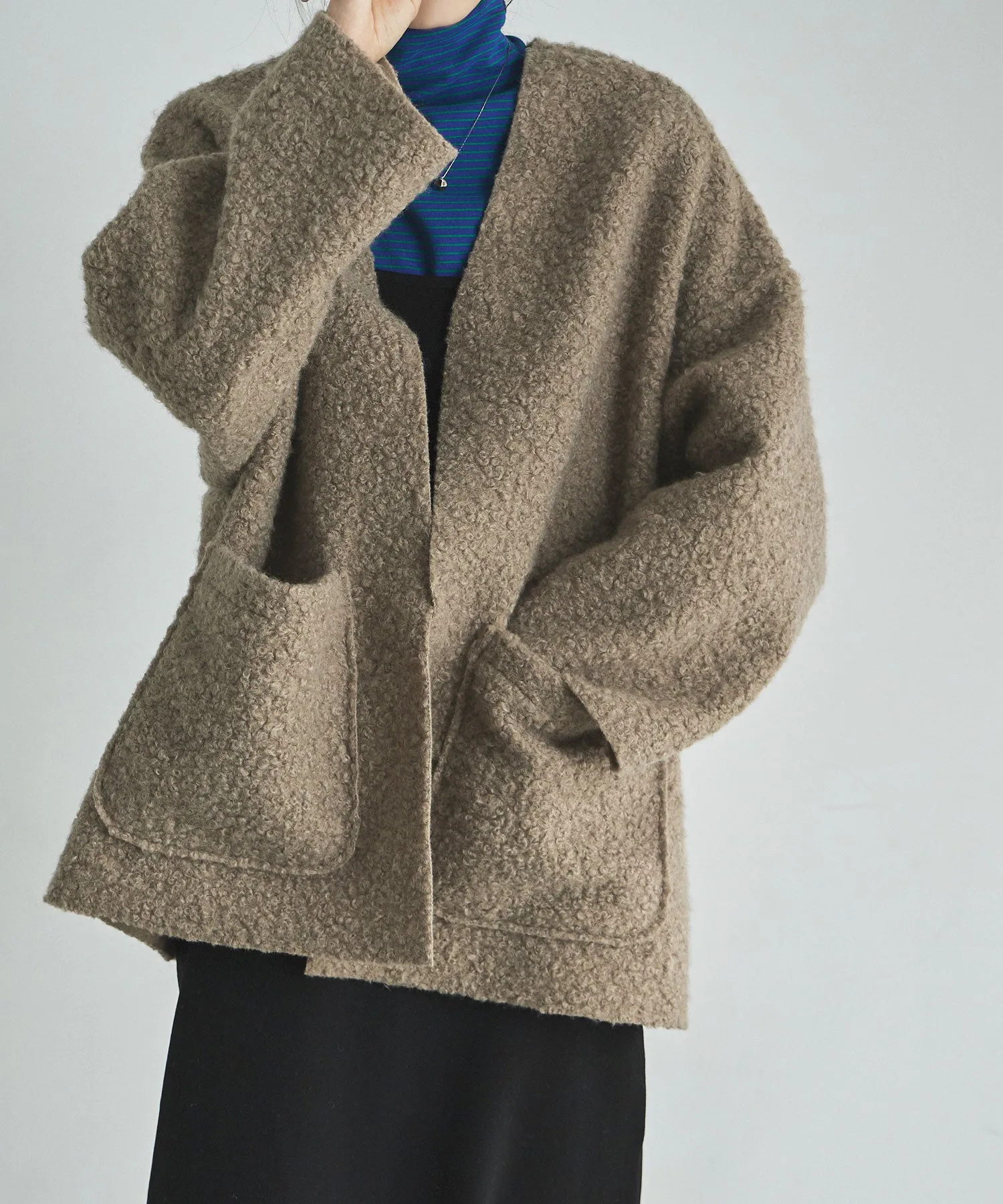 Ring wool over cardigan
