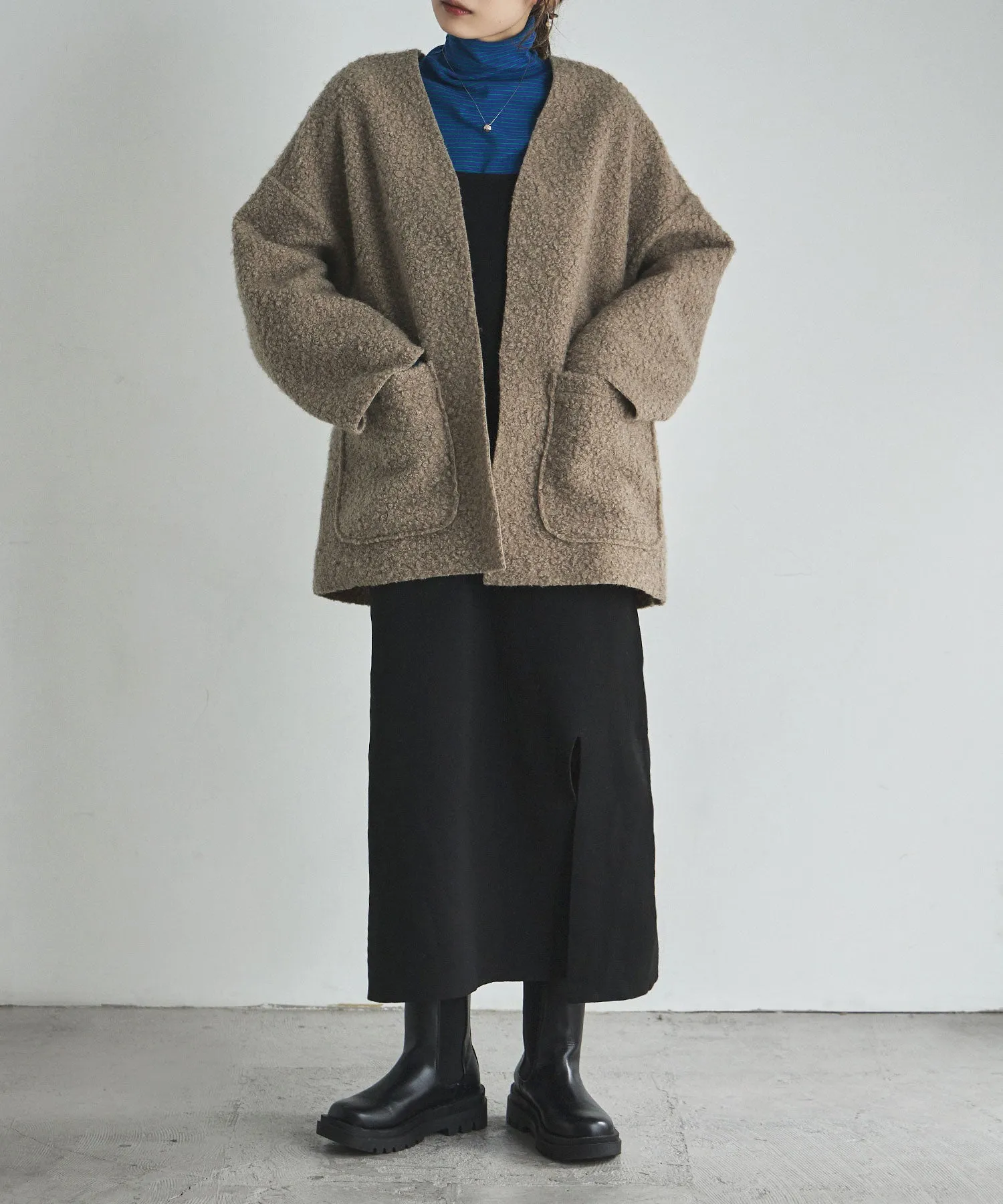 Ring wool over cardigan