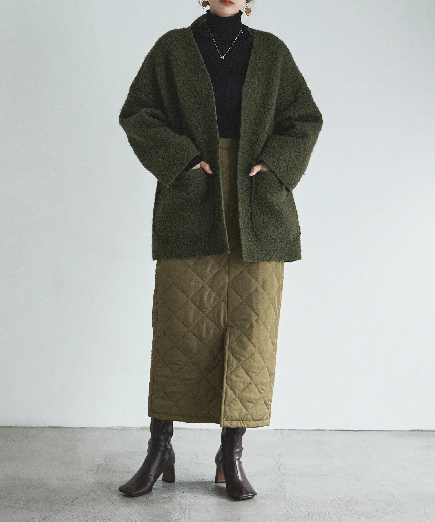 Ring wool over cardigan