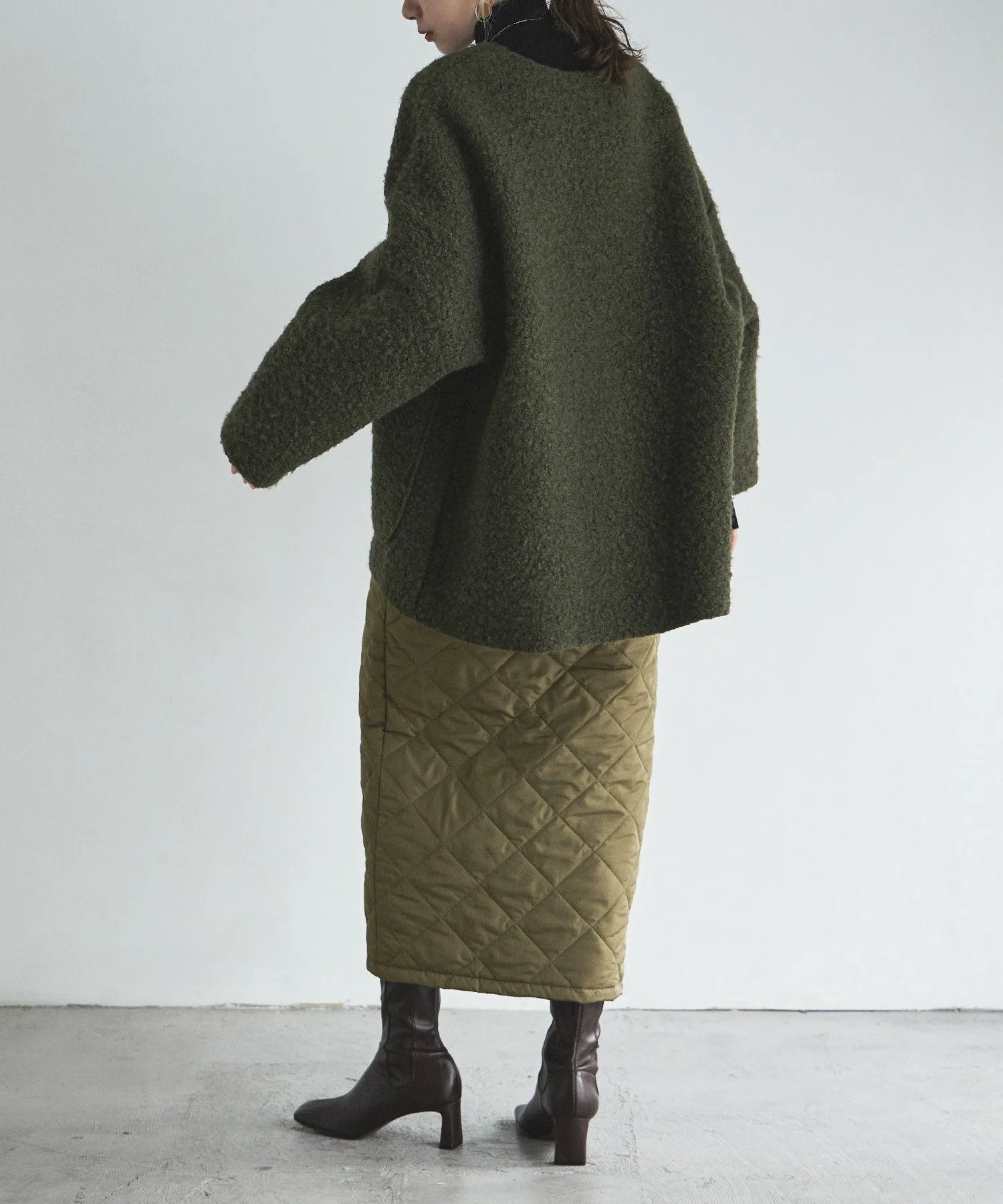Ring wool over cardigan